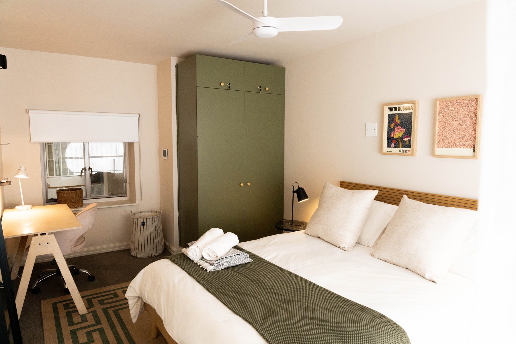 Bedroom with green wardrobe at Mutual Heights