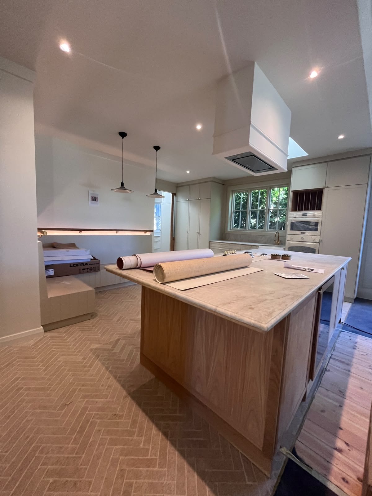 Kitchen island with pendant lights at Roseberry Avenue