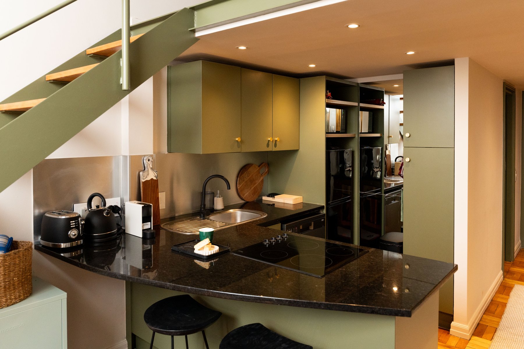 Olive green kitchen joinery at Mutual Heights